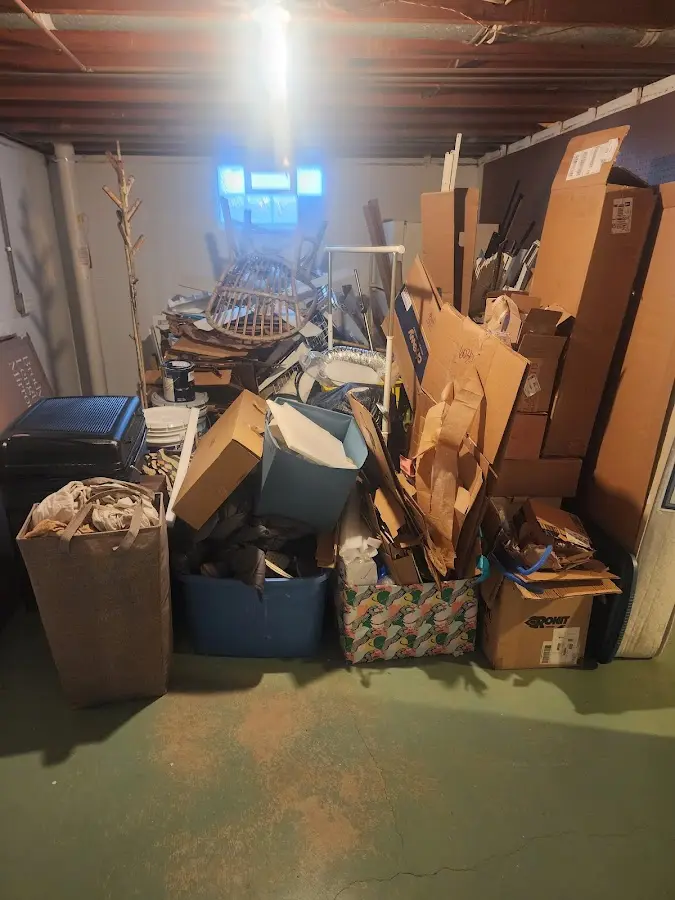 Roll-off dumpster container at job site for 15 Yard Dumpster Rental in Cranston